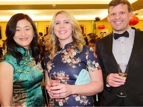 At the Hong Kong-Canada Business Association Calgary Sections Year of the Pig Chinese New Year Celebration at the Regency Palace Restaurant are Orbis the Flying Eye Hospital's Melody Song; Beth Henderson and her husband Alex Henderson, KPMG partner; and HKCBA Calgary president Alex Henderson.
