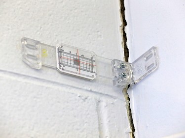 An engineering gauge measures a widening crack between two cinder block walls at the Foundations for the Future Academy's high school in Montgomery and shows the extent of the many structural failures throughout the building. Despite long standing government funding announcements they have yet to be repaired. The school was photographed on Thursday February 28, 2019.