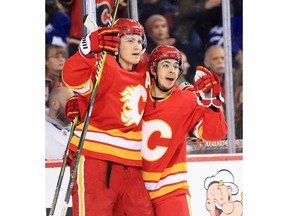 The Calgary Flames' Matthew Tkachuk, left and Johnny Gaudreau celebrate Gaudreau's goal on Toronto Maple Leafs goaltender Frederik Andersen during NHL action at the Scotiabank Saddledome in Calgary on Monday March 4, 2019.  Gavin Young/Postmedia