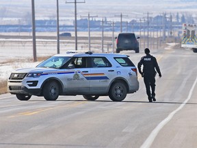 RCMP at the scene of a fatal shooting on Highway 817 near Strathmore on Sunday, March 17, 2019. Brandon Giffen has been charged in the death of Kristian Ayoungman, a Siksika man.