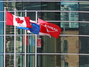 The flags outside the Enmax power plant on 9th avenue southeast in downtown Calgary were photographed on Monday March 25, 2019. Enmax announced Monday that U.S. based Emera Inc. has signed a deal to sell its operations in Maine to Enmax in a deal valued at $1.8 billion, including debt. Gavin Young/Postmedia