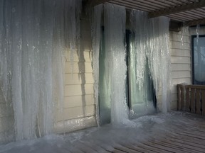 The continued deep freeze has caused the frost level in Calgary to move to a depth of eight feet. This file photo shows a frozen cascade of water clinging to a home on Berwick Crescent N.W. on Dec. 22, 2007.