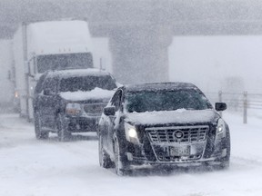 Traffic comes to a halt on eastbound Interstate 70 near Tower Road as a late winter storm packing hurricane-force winds and snow sweeps over the intermountain West Wednesday, March 13, 2019, in Aurora, Colo.