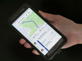 In this Aug. 8, 2018, file photo, a mobile phone displays a user's travels using Google Maps in New York.