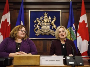 Alberta Premier Rachel Notley right and Deputy Premier of Alberta, and Minister of Health, Sarah Hoffman speak to cabinet members in Edmonton on Monday December 3, 2018. Premier Rachel Notley's government is considering legislation strengthening public health care as its signature Bill 1 when the house resumes sitting next week, sources tell