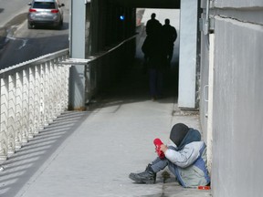 Karl Jackson, 47, originally from Belfast, Ireland, sits in an underpass on 1st Street S.W.
