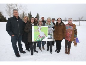 Family members hold a rendering of a planned park to be built in South Glenmore Park on Calgary on Tuesday, March 12, 2019.  The legacy project is being launched by the families of five inspiring young people: Lawrence Hong, Josh Hunter, Kaitlan (Kaiti) Perras, Jordan Segura, and Zackariah Rathwell, whose lives were lost on April 15, 2014 in the quiet suburban neighborhood of Brentwood in Calgary.