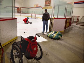 Humboldt Broncos hockey player Ryan Straschnitzki practices sledge hockey as his father Tom looks on during an early morning training session at East Calgary Twin Arenas in Calgary, on Wednesday February 13, 2019. Leah Hennel/Postmedia