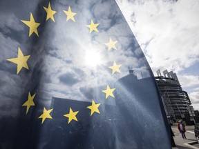 An EU flag flies at the front of the European Parliament building in Strasbourg, France, Tuesday March 26, 2019. The European Parliament is furiously debating the pros and cons of a landmark copyright bill one last time before the legislature will vote on it later.