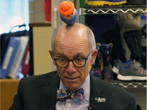 Alberta Party leader Stephen Mandel balances a toy on his head during a campaign announcement at Country Club Daycare and Out of School Care Centre in Edmonton on Wednesday March 20, 2019.