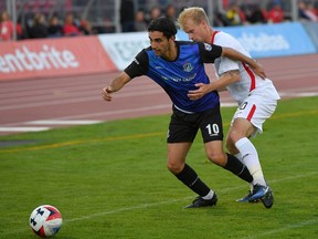 Then-FC Edmonton midfielder Mauro Eustaquio battles for the ball with San Francisco Deltas midfielder Kyle Bekker in North American Soccer League play in San Francisco in this file photo from 2017. Eustaquio has just signed on with Cavalry FC. Photo by Robert Edwards, KLC Photos/Special to Postmedia.