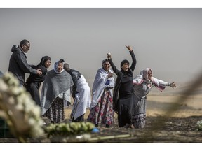 Ethiopian relatives of crash victims grieve at the site where the Ethiopian Airlines Boeing 737 Max 8 crashed shortly after takeoff on Sunday killing all 157 on board, near Bishoftu, south-east of Addis Ababa, in Ethiopia, on Thursday, March 14, 2019.