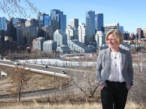 Rachel Notley poses with the city skyline and the Bow River in the background during a campaign stop in Calgary on Friday, March 22, 2019. Notley pledged new infrastructure to protect the city from the future risk of severe flooding.