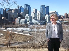 NDP Leader Rachel Notley poses with Calgary's skyline in the background during a campaign stop on March 22, 2019.