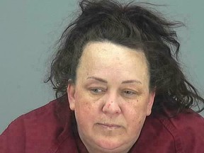 This booking photo provided by Pinal County Sheriff's Office shows Machelle Hackney. Authorities say, Tuesday, March 19, 2019, Hackney is accused of abusing seven adopted children, including using pepper spray on them and locking them in a closet. Hackney was booked into the Pinal County Jail on suspicion of two counts of molestation of a child, seven counts of child abuse and five counts each of unlawful imprisonment and child neglect. (Pinal County Sheriff's Office via AP)