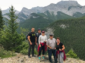 An image of a group of people hiking Heart Mountain near Canmore, Alberta in the Canadian Rockies
