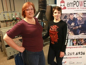 Amanda Oliver, left, and Megan Palko, students from emPOWER, SAIT's women in trades program, pose for a photo at the program's launch on International Women's Day Friday, March 8, 2019.