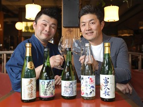 L-R, Yasuhiro Washiyama and Toshiki Uehara of Sake Gami Premium Sake Importer are bringing in new Saki's into Calgary on Saturday, March 16, 2019. Photo taken at Two Penny restaurant in Calgary. Darren Makowichuk/Postmedia