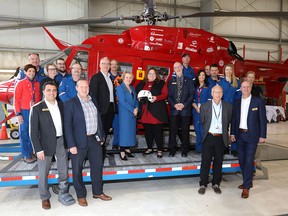 Andrea Robertson, president and CEO of STARS and Sarah Hoffman, Minister of Health, centre, were on hand as the province announced funding for a new STARS helicopter Saturday, March 16.