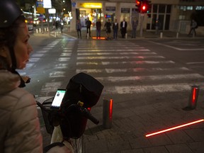 Tel Aviv has taken its first steps to assist pedestrians distracted by their smartphones by embedding LED stoplights at crosswalks.
