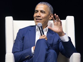 Former President Barack Obama addresses the Winnipeg audience during his presentation at the Bell MTS Place on Monday.