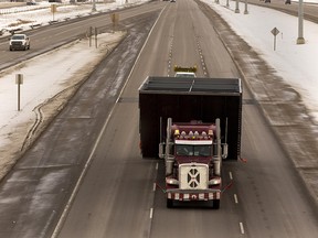 A truck carrying a wide load makes its way down Highway 16 east of Edmonton on Jan. 22, 2019.