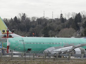 In this photo taken Monday, March 11, 2019, a Boeing 737 MAX 8 airplane being built for Air Canada sits parked at Boeing Co.'s Renton Assembly Plant in Renton, Wash.