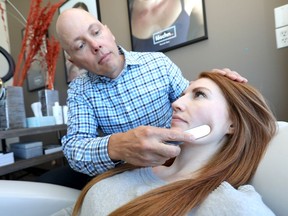 Dr. Robin Scholz performs the Loschn Facial Method using a 6 inch stainless steel surgical tool on patient, Alexandra Robertson at the Westside Chiropractic Sports and Dance Therapy Centre in Calgary for a Lifestye story on Tuesday March 5, 2019. Darren Makowichuk/Postmedia