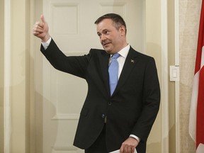 Jason Kenney gives a thumbs up as he is sworn in as premier of Alberta in Edmonton on Tuesday, April 30, 2019.