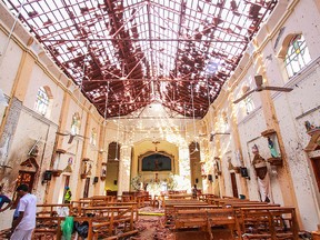 Sri Lankan officials inspect St. Sebastian's Church in Negombo, north of Colombo, after multiple explosions targeting churches and hotels across Sri Lanka on April 21, 2019, in Negombo, Sri Lanka.