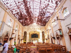 NEGOMBO, SRI LANKA - APRIL 21: Sri Lankan officials inspect St. Sebastian's Church in Negombo, north of Colombo, after multiple explosions targeting churches and hotels across Sri Lanka on April 21, 2019, in Negombo, Sri Lanka. At least 207 people have been killed and hundreds more injured after multiple explosions rocked three churches and three luxury hotels in and around Colombo as well as at Batticaloa in Sri Lanka during Easter Sunday mass. According to reports, at least 400 people were injured and are undergoing treatment as the blasts took place at churches in Colombo city as well as neighboring towns and hotels, including the Shangri-La, Kingsbury and Cinnamon Grand, during the worst violence in Sri Lanka since the civil war ended a decade ago. Christians worldwide celebrated Easter on Sunday, commemorating the day on which Jesus Christ is believed to have risen from the dead. (Photo by Stringer/Getty Images) *** BESTPIX ***