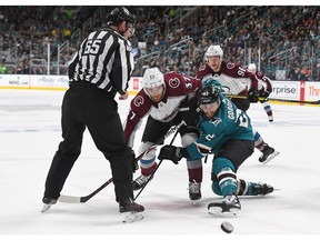 SAN JOSE, CA - APRIL 26:  Barclay Goodrow #23 of the San Jose Sharks and J.T. Compher #37 of the Colorado Avalanche battles for a faceoff during the third period in Game One of the Western Conference Second Round during the 2019 NHL Stanley Cup Playoffs at SAP Center on April 26, 2019 in San Jose, California. The Sharks won the game 5-2.