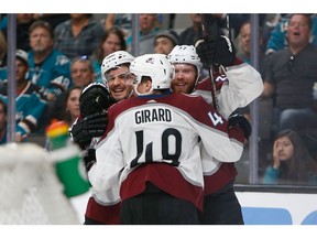 SAN JOSE, CA - APRIL 28: Matt Nieto #83, Samuel Girard #49 and J.T. Compher #37 of the Colorado Avalanche celebrate after a goal in the third period against the San Jose Sharks in Game Two of the Western Conference Second Round during the 2019 NHL Stanley Cup Playoffs at SAP Center on April 28, 2019 in San Jose, California.