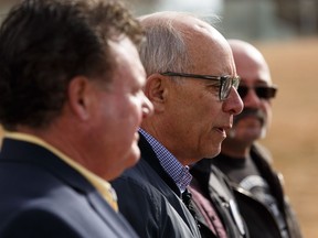 Alberta Party Leader Stephen Mandel (second from left) speaks about a robocall that seeming showed his incorrect support for a UCP government sent to Bob Wispinski (right) during a news conference with Alberta Party candidates Dave Quest (left) and Marvin Olsen outside the Federal Building in Edmonton, on Sunday, April 14, 2019.