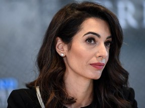 In this file photo taken on April 5, 2019 Lebanese-British human-rights lawyer Amal Clooney holds a press briefing on her Media Freedom Campaign on April 5, 2019 in Dinard, western France.