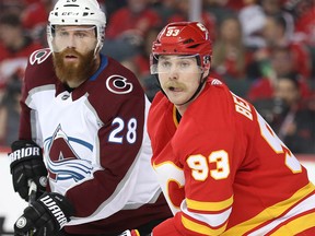 Calgary Flames Sam Bennett battles against Ian Cole of the Colorado Avalanche in Game One of the Western Conference First Round during the 2019 NHL Stanley Cup Playoffs at the Scotiabank Saddledome in Calgary on Thursday, April 11, 2019. Al Charest/Postmedia
