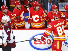 Calgary Flames  Andrew Mangiapane celebrates with teammates after scoring against the Colorado Avalanche in Game One of the Western Conference First Round during the 2019 NHL Stanley Cup Playoffs at the Scotiabank Saddledome in Calgary on Thursday, April 11, 2019. Al Charest/Postmedia