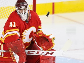 Calgary Flames goalie Mike Smith makes a save on a shot by Colorado Avalanche in Game One of the Western Conference First Round during the 2019 NHL Stanley Cup Playoffs at the Scotiabank Saddledome in Calgary on Thursday, April 11, 2019. Al Charest/Postmedia