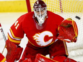 Calgary Flames goalie Mike Smith makes a save on a shot by Colorado Avalanche in game two of the Western Conference First Round during the 2019 NHL Stanley Cup Playoffs at the Scotiabank Saddledome in Calgary on Saturday, April 13, 2019. Al Charest/Postmedia