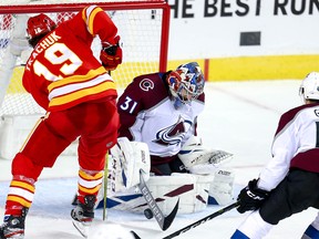 Colorado Avalanche goalie Philipp Grubauer makes a save on Matthew Tkachuk of the Calgary Flames late in the third period in game two of the Western Conference First Round during the 2019 NHL Stanley Cup Playoffs at the Scotiabank Saddledome in Calgary on Saturday, April 13, 2019. Al Charest/Postmedia