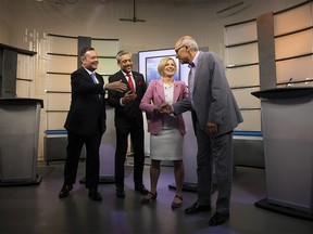 United Conservative Party leader Jason Kenney, left to right, Alberta Liberal Party leader David Khan, Alberta New Democrat Party leader and incumbent premier Rachel Notley and Alberta Party leader Stephen Mandel greet each before the start of the 2019 Alberta Leaders Debate in Edmonton, Alta., on Thursday, April 4, 2019. THE CANADIAN PRESS/Codie McLachlan ORG XMIT: CKM110