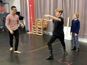 Choreographer Yukichi Hattori works with Rhett Udsen and Dex Drewitz during rehearsals for Billy Elliot the Musical at Theatre Calgary.