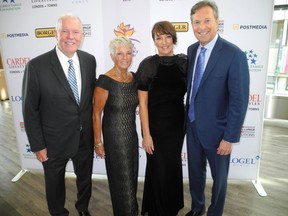 The Calgary Women's Emergency Shelter's 25 Years of Turning Points Gala April 25 at the Telus Convention Centre raised $676,230 for the invaluable charity. Pictured with Turning Points co-chairs Shelly Norris (second from left) and Sherri Logel are their husbands Alan Norris (left) and Tim Logel.