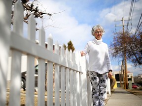 Rita Bercan stands outside her father Aldo's northeast Calgary home on Tuesday April 2, 2019. Bercan says the city's new automated visitor parking system is causing problems for her father and his caregiver who visits daily. She says the system is complex, and requires everyone to remember to call at least once every two weeks, something many seniors will struggle with. Gavin Young/Postmedia