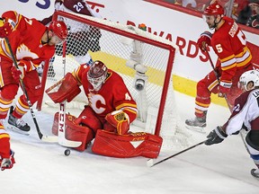 Calgary Flames goaltender Mike Smith stops this Colorado Avalanche scoring chance during game two Stanley Cup playoff action in Calgary on Saturday April 13, 2019. Gavin Young/Postmedia