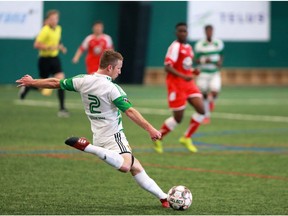 Calgary Foothills FC's Dean Northover kicks the ball upfield during action against the TSS Rovers at the Calgary Foothills Soccer Club. Gavin Young/Postmedia