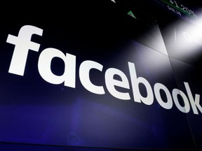 In this March 29, 2018, file photo the logo for social media giant Facebook, appears on screens at the Nasdaq MarketSite, in New York's Times Square. The federal and B.C. privacy watchdogs say Facebook's ineffective safeguards allowed unauthorized access to the information of millions of the social media giant's users - including data later used for political purposes.
