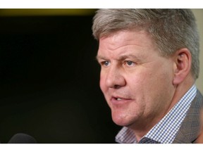 Calgary Flames coach Bill Peters speaks to media after arriving in Calgary with the team from Colorado Thursday, April 18, 2019 following game four against the Avalanche. Jim Wells/Postmedia