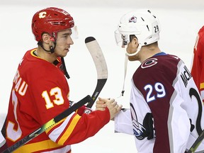 Flames Johnny Gaudreau (L) shakes hands with Nathan MacKinnon following game five between the Colorado Avalanche and Calgary Flames in Calgary on Friday, April 19, 2019. Flames lost 5-1. Jim Wells/Postmedia