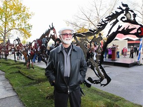 Renowned artist Joe Fafard stands with his work entitled Do Re Me Fa Sol La Si Do, when it was unveiled on the Stampede Grounds in October 2010. The sculpture made its temporary home there until it was moved to the Calgary Court Centre downtown. Gavin Young, Calgary Herald.